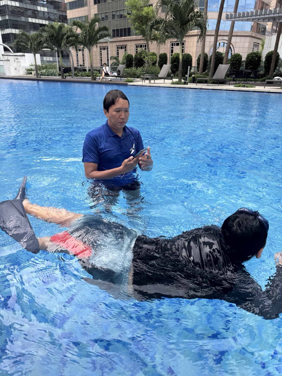 Adult learner receiving private swimming coaching in Singapore